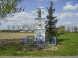 Przydrożna kapliczka słupowa świętego Wawrzyńca. Kunowo, gmina Łobżenica, powiat pilski.